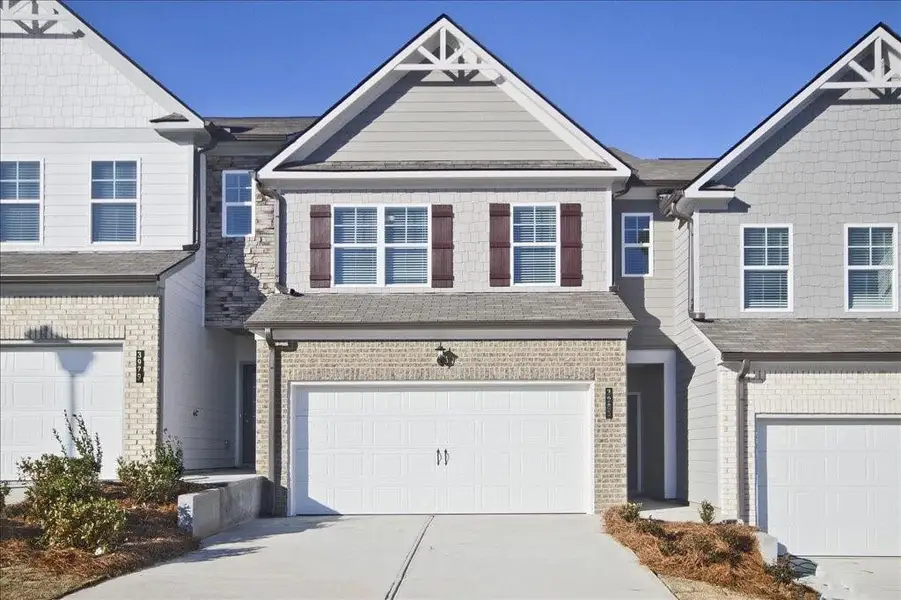Front exterior of a new home in , Gainesville, GA, highlighting curb appeal (Image 1). Front exterior of a new home in , Gainesville, GA, highlighting curb appeal (Image 1).