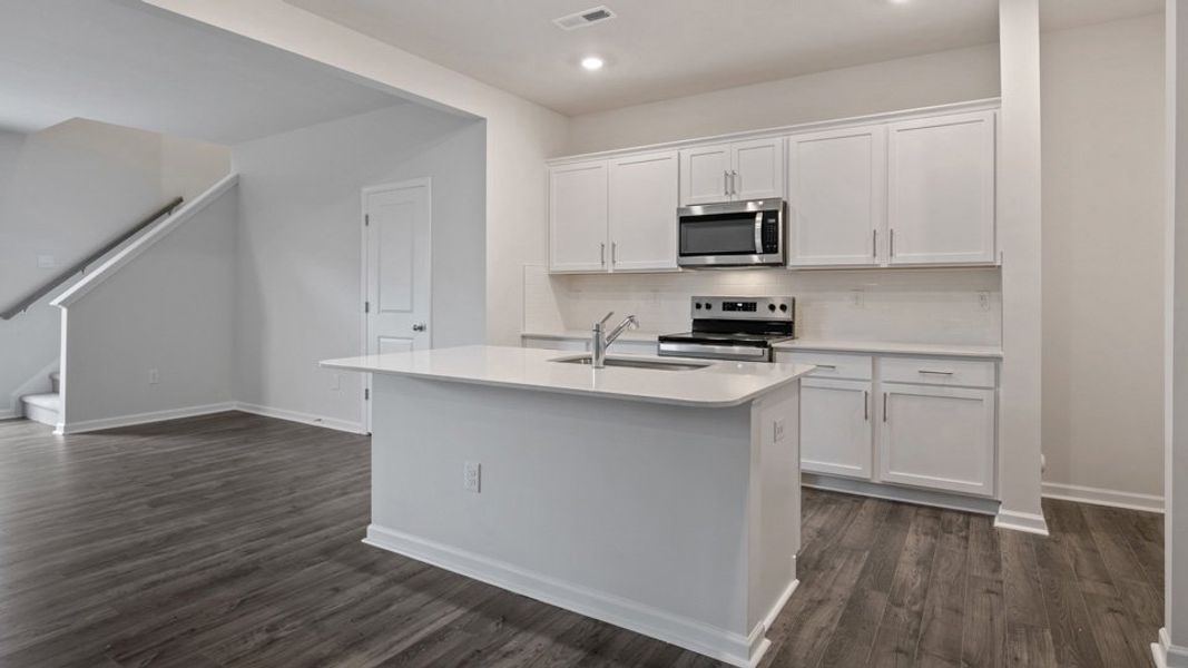 Furnished interior view inside a new home in The Grove at Matthews Landing, Fuquay Varina (Image 6).