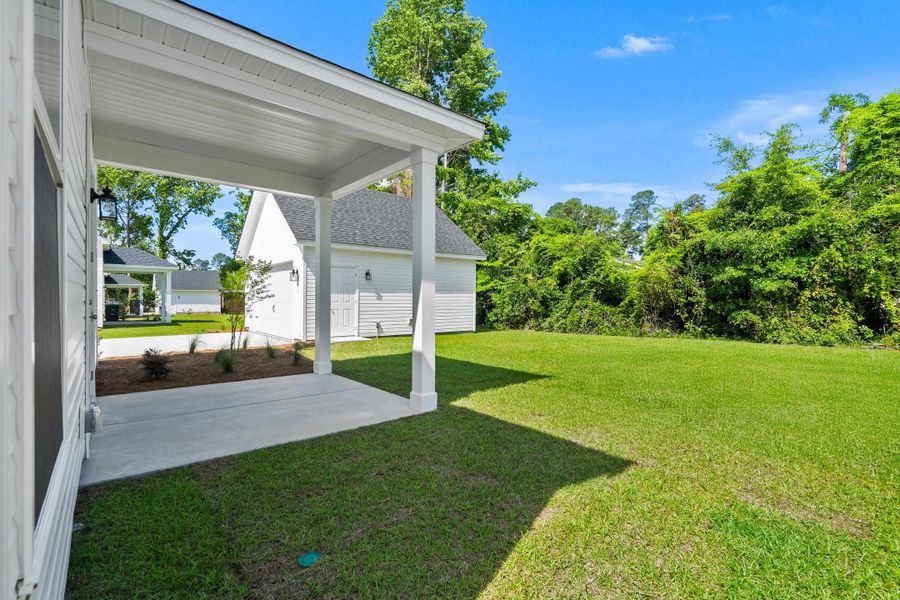Exterior details and patio area of a home in Downtown Loris Homes, Loris (Image 26).