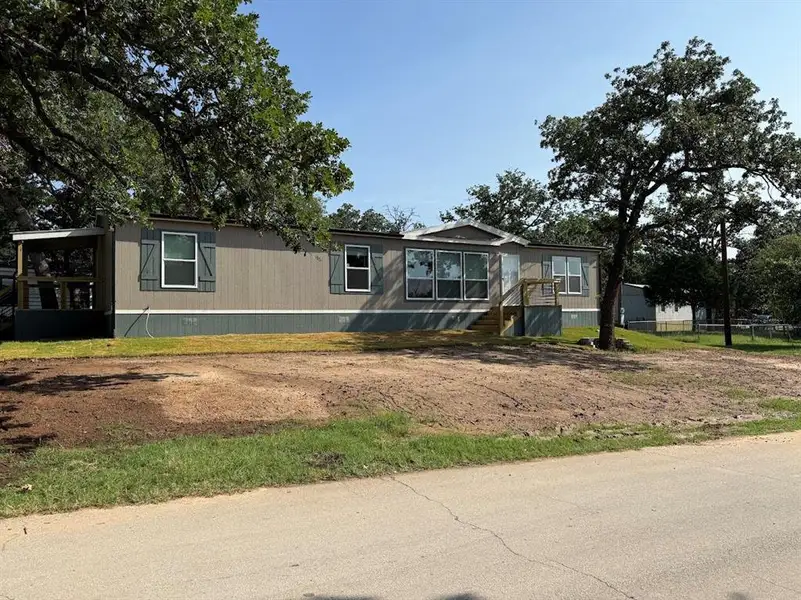 Exterior details and patio area of a home in , Pelican Bay (Image 13).