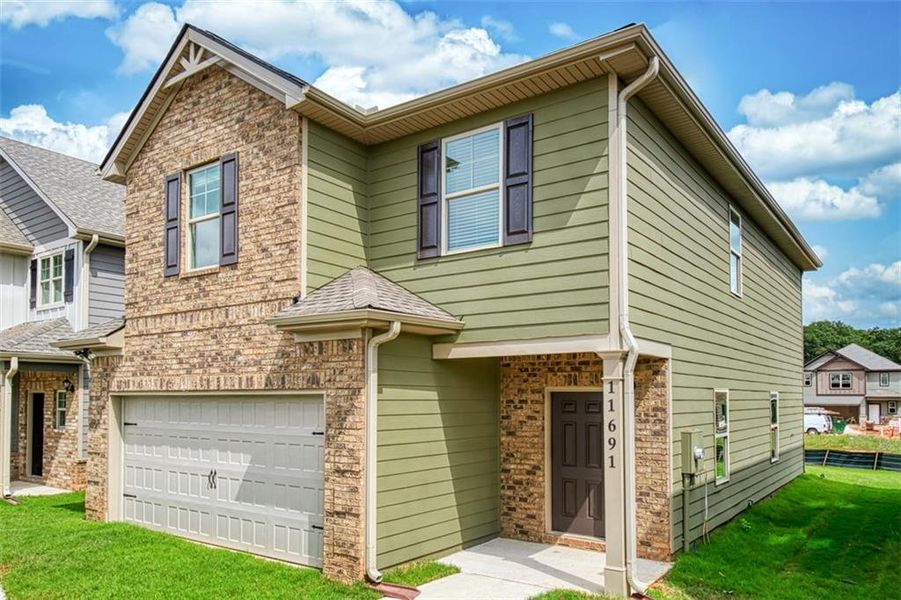 Front exterior of a new home in Westminster, Covington, GA, highlighting curb appeal (Image 2).