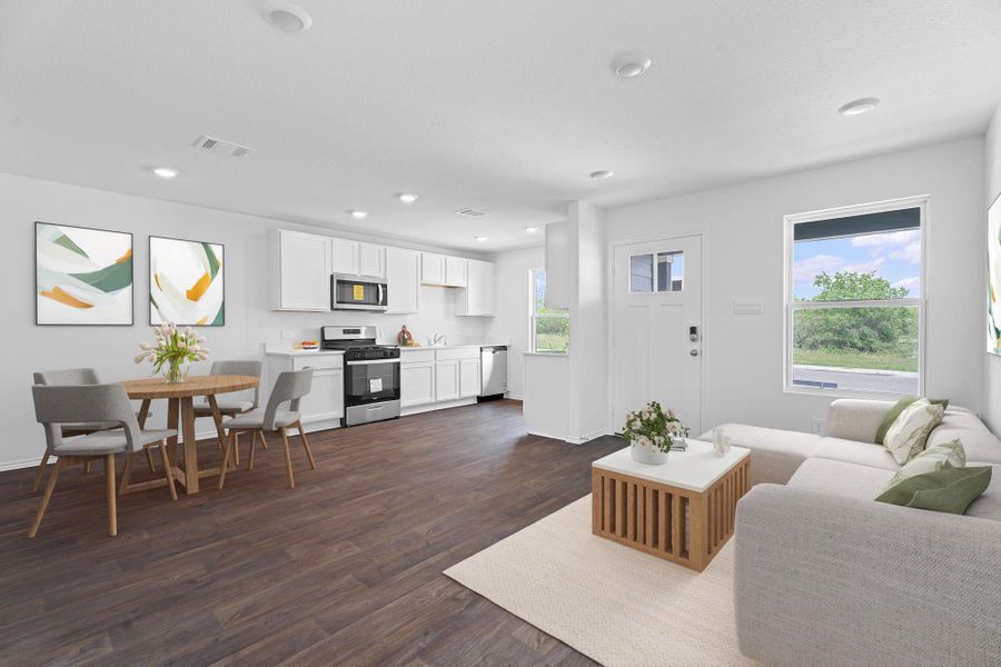 Living area featuring visible vents, baseboards, dark wood-type flooring, and recessed lighting Living area featuring visible vents, baseboards, dark wood-type flooring, and recessed lighting