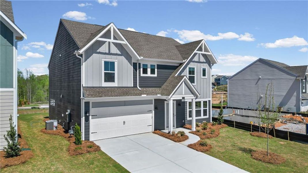 Front exterior of a new home in Twin Lakes, Hoschton, GA, highlighting curb appeal (Image 26).