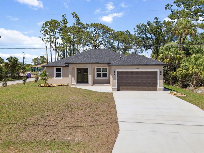 Front exterior of a new home in , North Port, FL, highlighting curb appeal (Image 15).