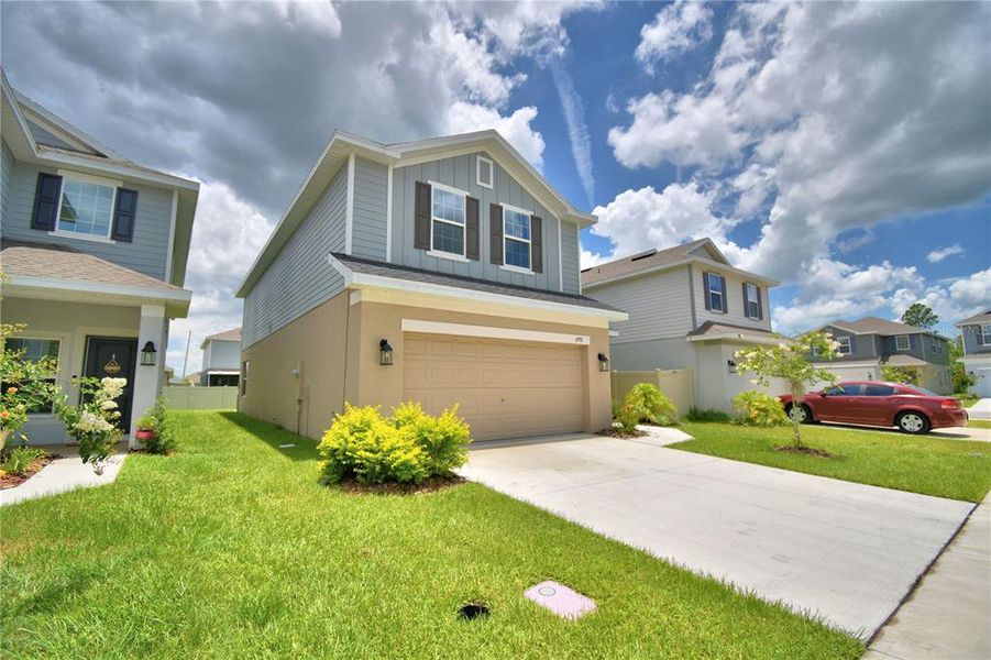 Front exterior of a new home in Villamar, Winter Haven, FL, highlighting curb appeal (Image 11). Front exterior of a new home in Villamar, Winter Haven, FL, highlighting curb appeal (Image 11).