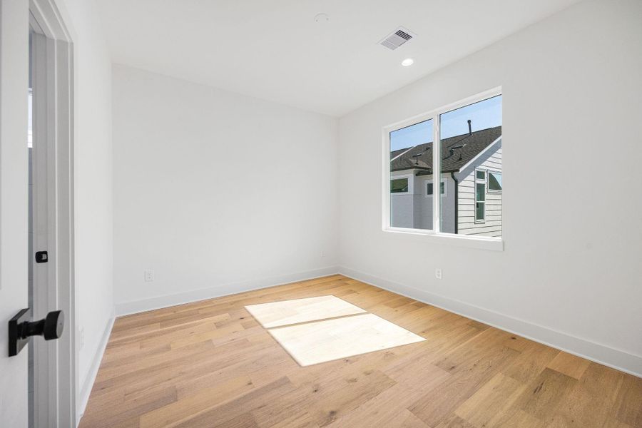 Secondary bedroom located on the third floor with attached bathroom