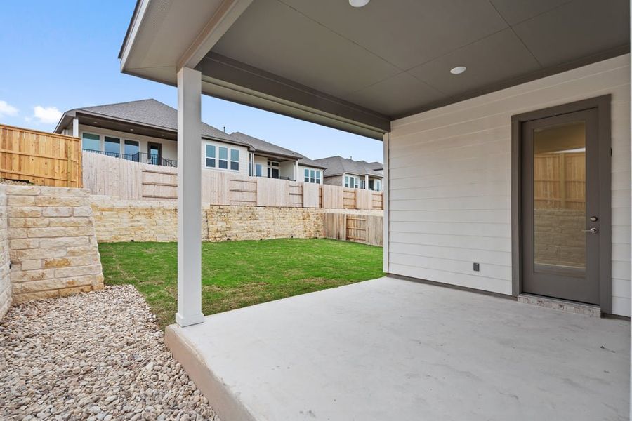 Exterior details and patio area of a home in Park Collection at Lariat, Liberty Hill (Image 27).