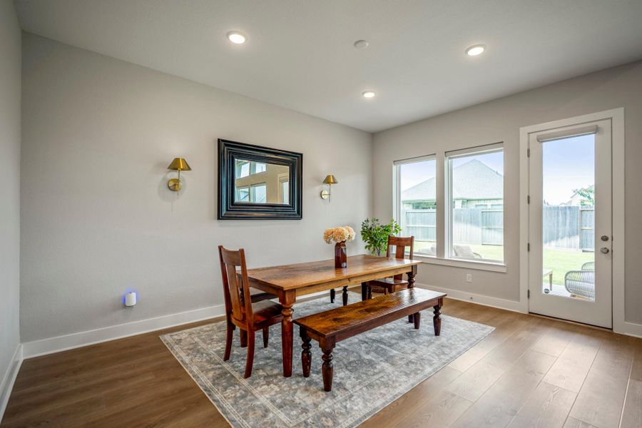 Windows fill the dining area with natural light, while direct access to the covered patio and backyard makes it easy to take meals, celebrations and everyday moments outside.