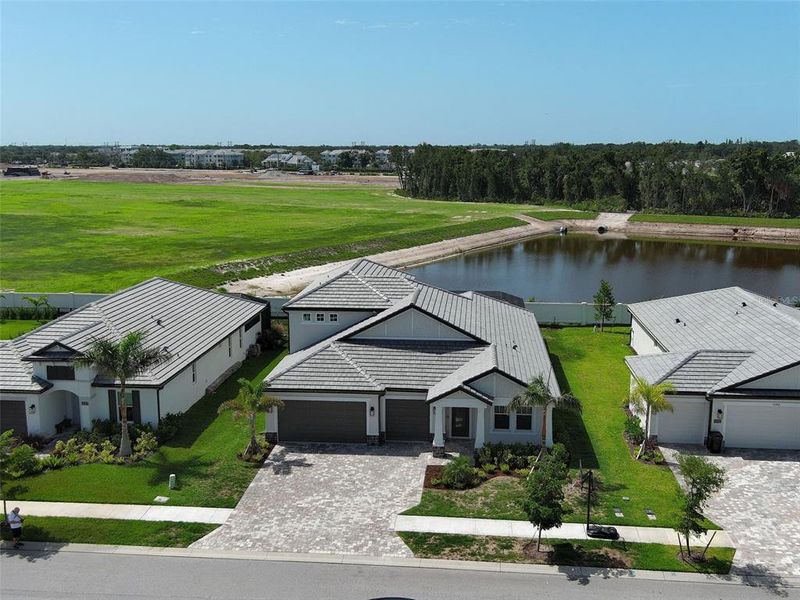 Front exterior of a new home in , Nokomis, FL, highlighting curb appeal (Image 31). Front exterior of a new home in , Nokomis, FL, highlighting curb appeal (Image 31).
