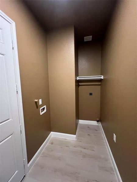 Washroom with hookup for an electric dryer and baseboards Washroom with hookup for an electric dryer and baseboards
