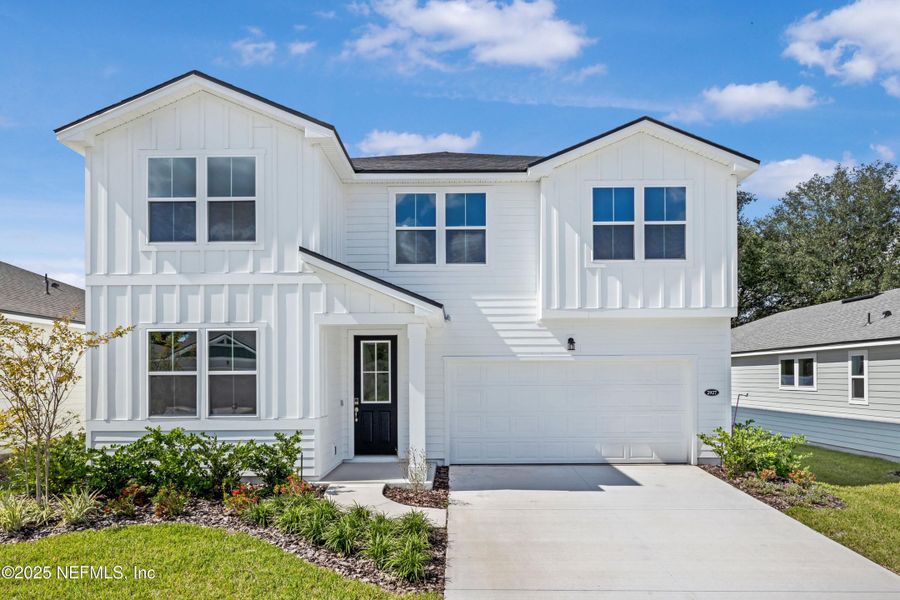 Front exterior of a new home in Sandridge Hills, Green Cove Springs, FL, highlighting curb appeal (Image 1). Front exterior of a new home in Sandridge Hills, Green Cove Springs, FL, highlighting curb appeal (Image 1).