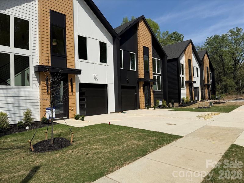 Front exterior of a new home in , Charlotte, NC, highlighting curb appeal (Image 23).