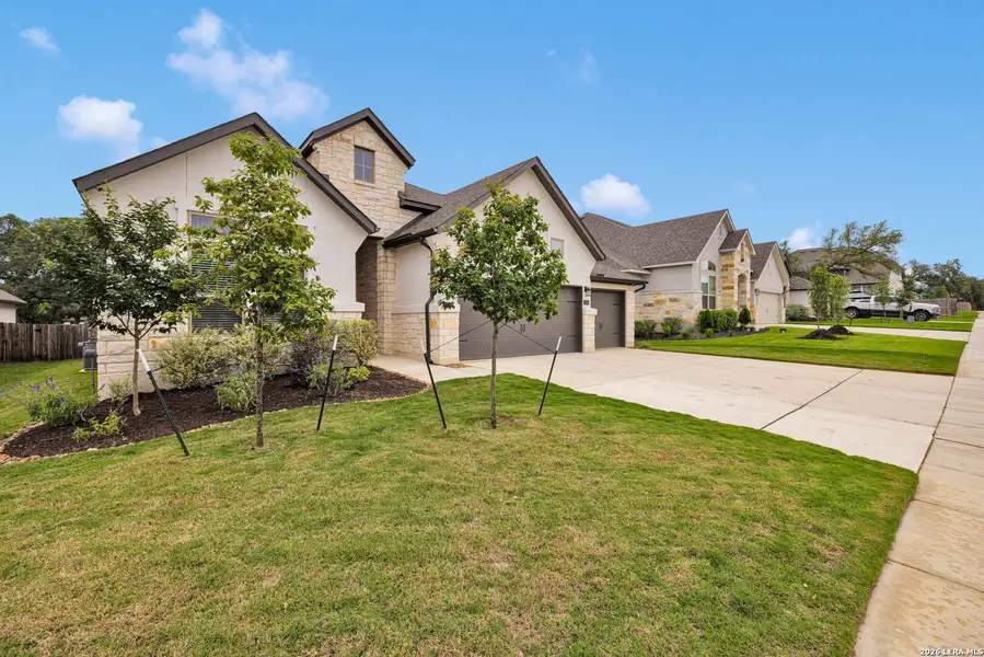 Front exterior of a new home in , Boerne, TX, highlighting curb appeal (Image 24).