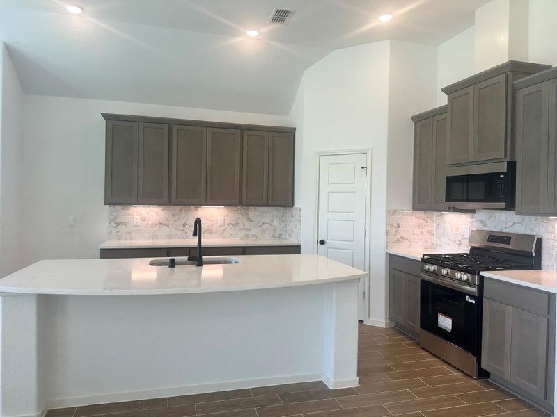 Furnished interior view inside a new home in Creekhaven, Iowa Colony (Image 11).
