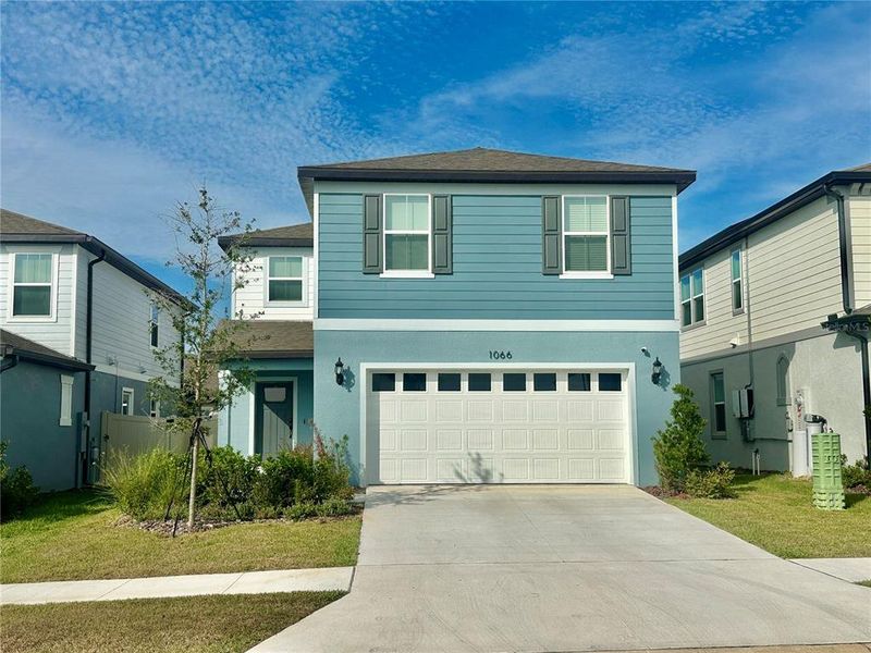Front exterior of a new home in Silverlake, Lake Alfred, FL, highlighting curb appeal (Image 2). Front exterior of a new home in Silverlake, Lake Alfred, FL, highlighting curb appeal (Image 2).