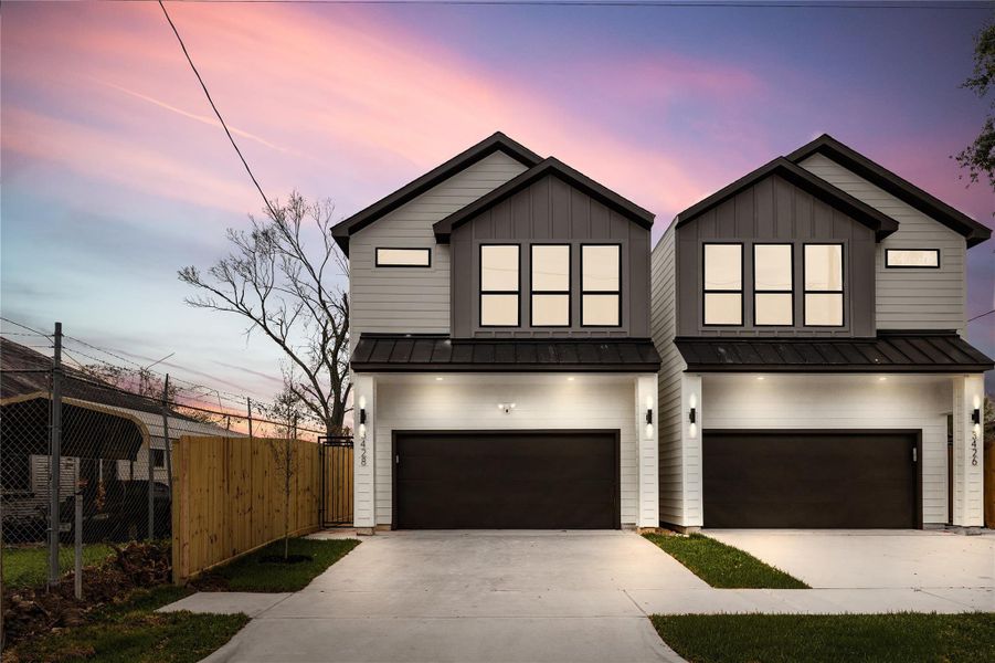 A stunning twilight exterior creates a warm, inviting glow that makes the home feel even more welcoming. The modern façade and clean lines truly shine, offering standout curb appeal day or night.