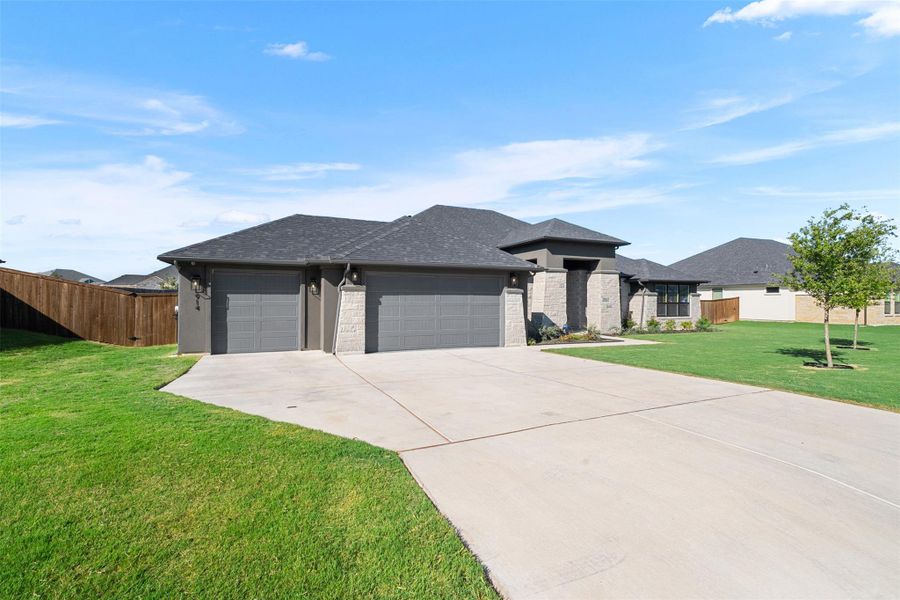 Front exterior of a new home in , Nolanville, TX, highlighting curb appeal (Image 2).