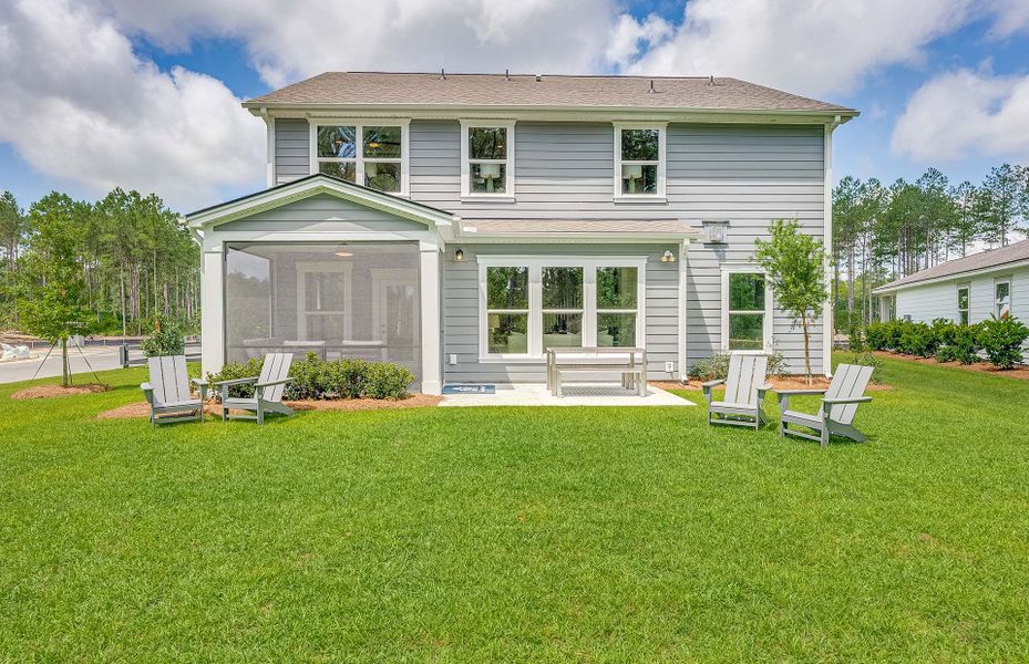 Screened porch with attached patio overlooking the backyard