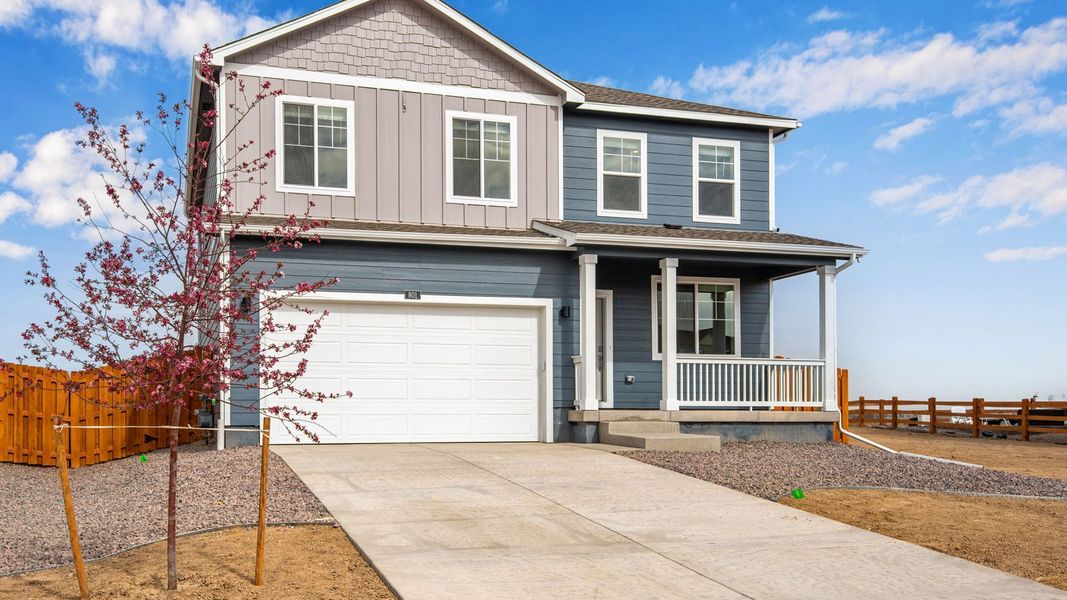 Front exterior of a new home in Vista Meadows, Fort Lupton, CO, highlighting curb appeal (Image 1). Front exterior of a new home in Vista Meadows, Fort Lupton, CO, highlighting curb appeal (Image 1).
