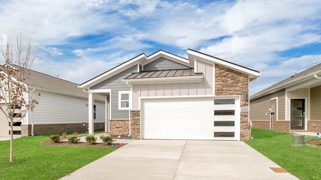 Front exterior of a new home in Nexus South, Gallatin, TN, highlighting curb appeal (Image 1). Front exterior of a new home in Nexus South, Gallatin, TN, highlighting curb appeal (Image 1).