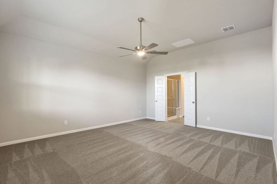 Primary Bedroom in the Sapphire home plan by Trophy Signature Homes – REPRESENTATIVE PHOTO Primary Bedroom in the Sapphire home plan by Trophy Signature Homes – REPRESENTATIVE PHOTO