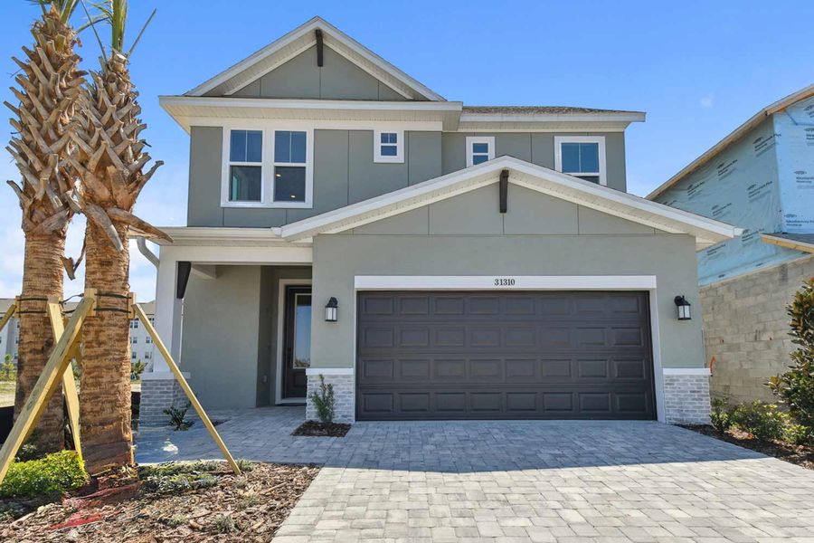 Representative exterior photo of a completed home built from the The Runion by David Weekley Homes in Chapel Crossings - Garden Series, Wesley Chapel, FL (Image 10).