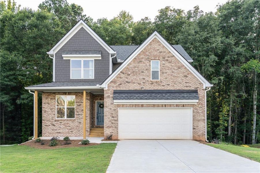 Front exterior of a new home in , Ellenwood, GA, highlighting curb appeal (Image 1). Front exterior of a new home in , Ellenwood, GA, highlighting curb appeal (Image 1).