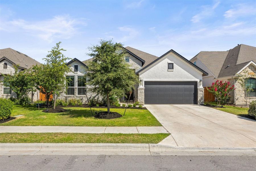 Front exterior of a new home in Sweetwater, Austin, TX, highlighting curb appeal (Image 2).