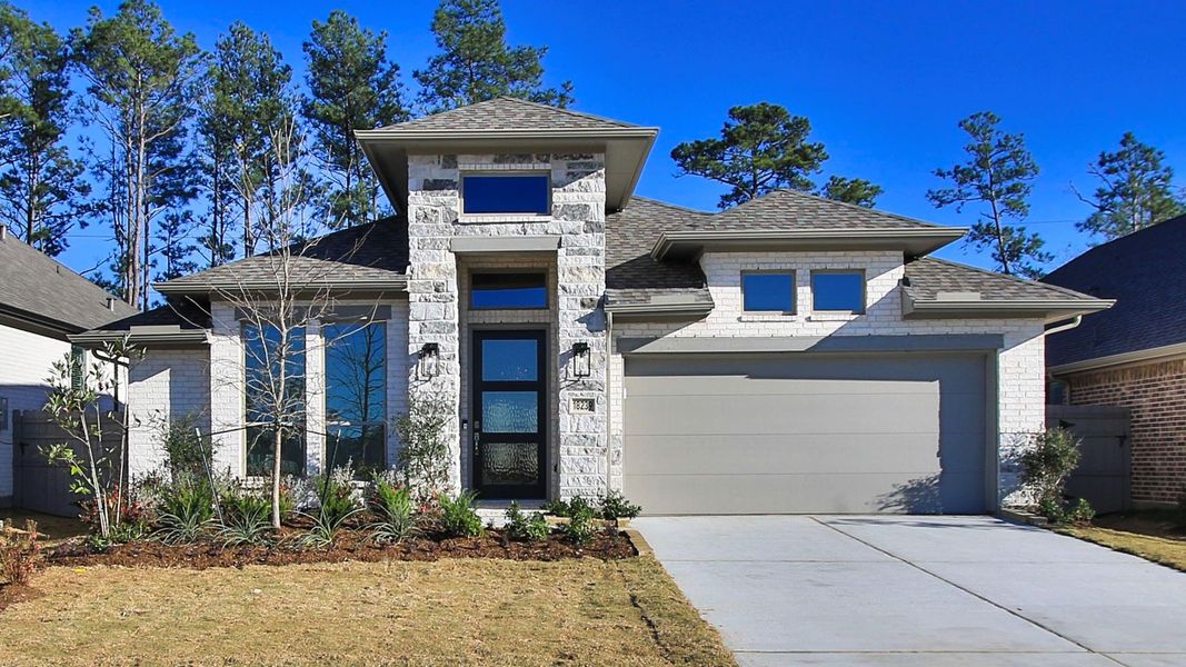 Front exterior of a new home in Artavia, Conroe, TX, highlighting curb appeal (Image 2).
