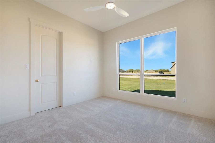 Unfurnished room featuring light carpet and baseboards Unfurnished room featuring light carpet and baseboards