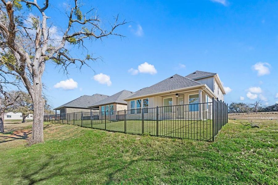 Exterior details and patio area of a home in The Resort on Eagle Mt. Lake, Fort Worth (Image 22).