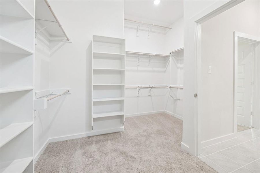 Primary Closet in the Claret home plan by Trophy Signature Homes  REPRESENTATIVE PHOTO