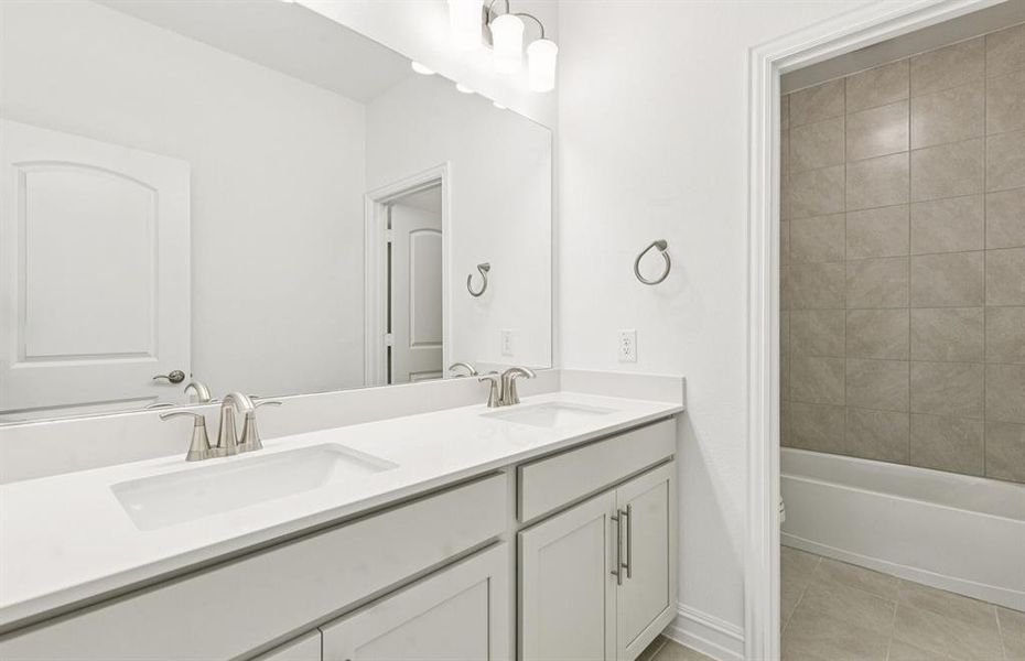 Spacious secondary bathroom with double sinks Spacious secondary bathroom with double sinks