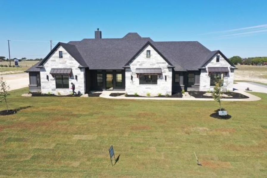 View of front of home with a front yard