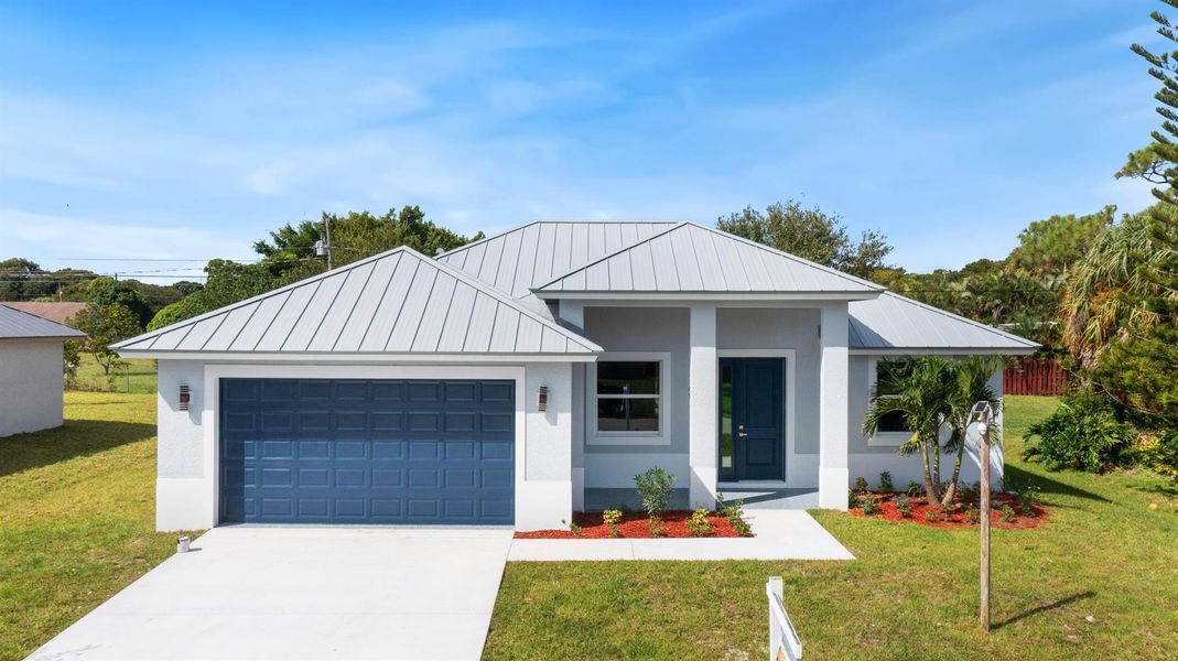 Front exterior of a new home in , Fort Pierce, FL, highlighting curb appeal (Image 2). Front exterior of a new home in , Fort Pierce, FL, highlighting curb appeal (Image 2).