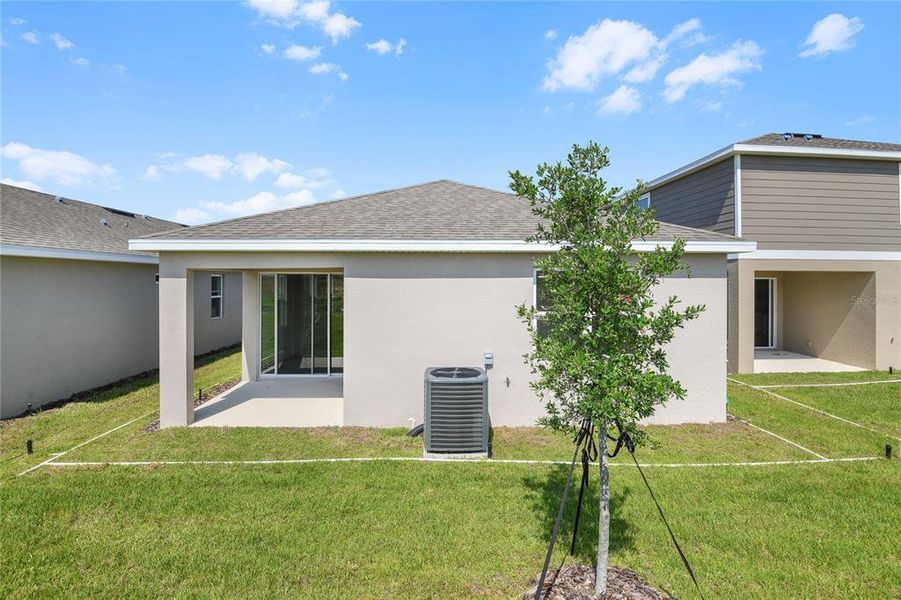 Front exterior of a new home in Seasons at Scenic Terrace, Lake Hamilton, FL, highlighting curb appeal (Image 14).