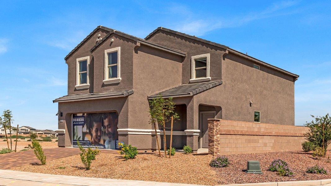 Front exterior of a new home in Coronet at Gladden Farms, Marana, AZ, highlighting curb appeal (Image 2).