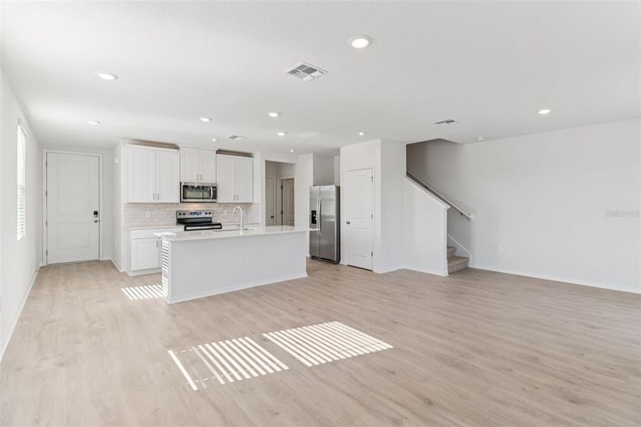 Spacious, unfurnished interior of a new home in The Reserve at Hammock Oaks Townes, Lady Lake (Image 15).