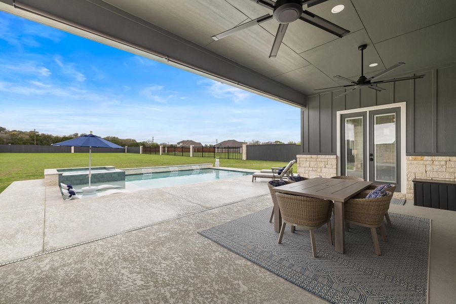 Covered patio perfect for outdoor dining and relaxing evenings.