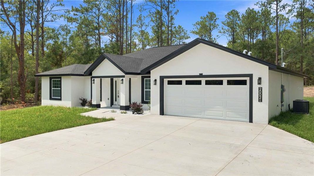 Front exterior of a new home in , Dunnellon, FL, highlighting curb appeal (Image 18). Front exterior of a new home in , Dunnellon, FL, highlighting curb appeal (Image 18).