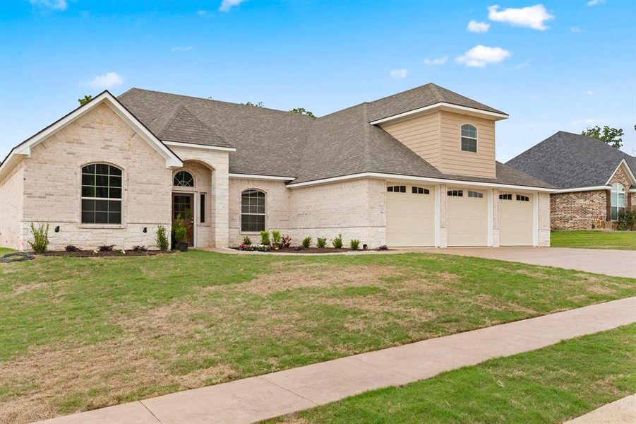 Front exterior of a new home in , Lindale, TX, highlighting curb appeal (Image 25).
