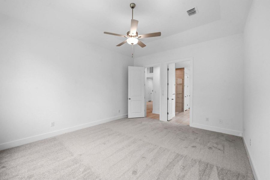 Primary Bedroom with elevated ceiling