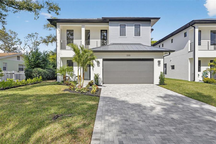 Front exterior of a new home in , Sarasota, FL, highlighting curb appeal (Image 2).