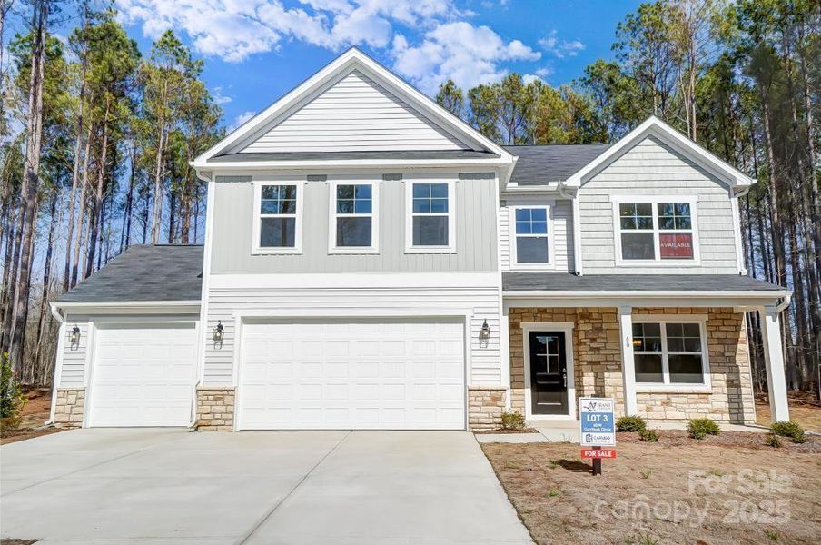 Front exterior of a new home in , Hickory, NC, highlighting curb appeal (Image 1).