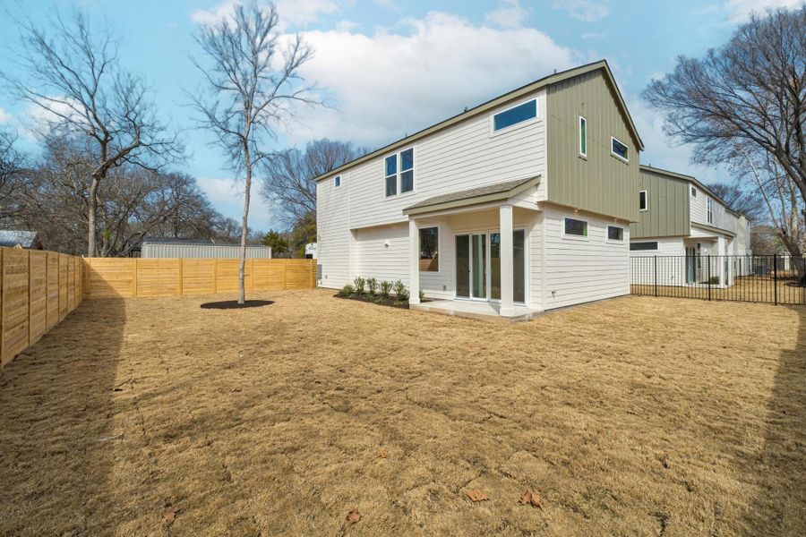 Rear view of property. A fully fenced extensive patio for your enjoyment!