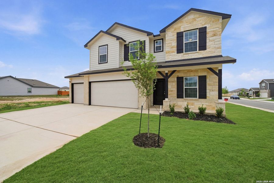 Front exterior of a new home in Hennersby Hollow, San Antonio, TX, highlighting curb appeal (Image 20).