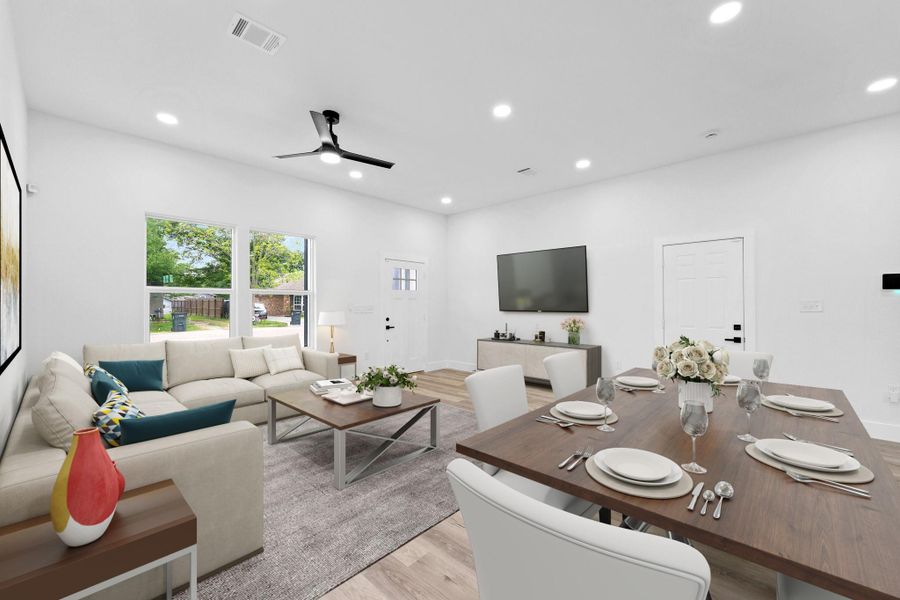 Virtually Staged: You'll be instantly greeted by the beautiful living room with vinyl plank floors, and recessed lighting.