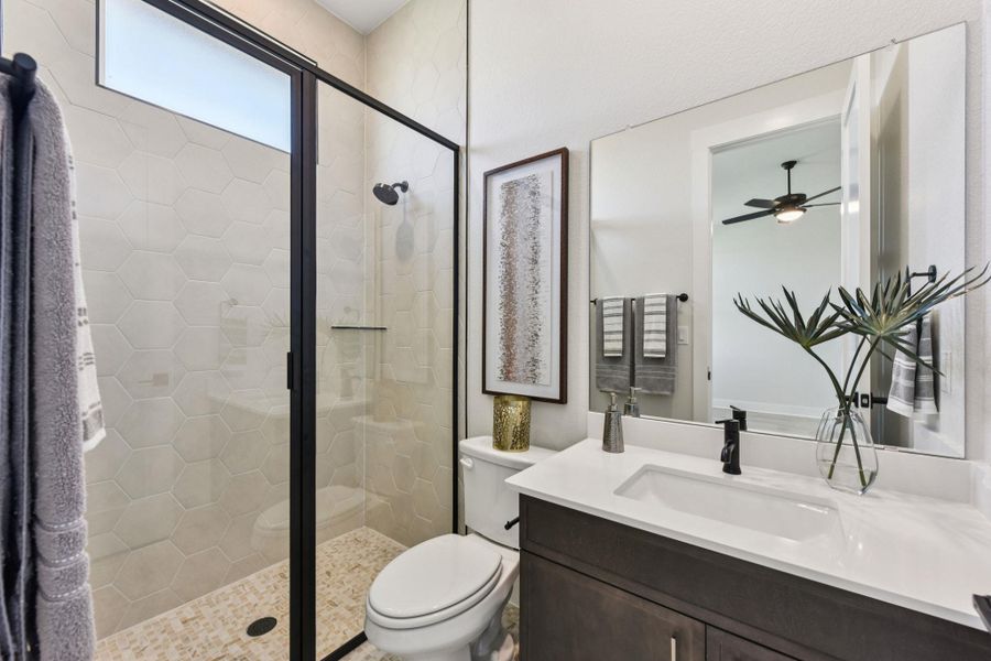 Bathroom with vanity and a stall shower