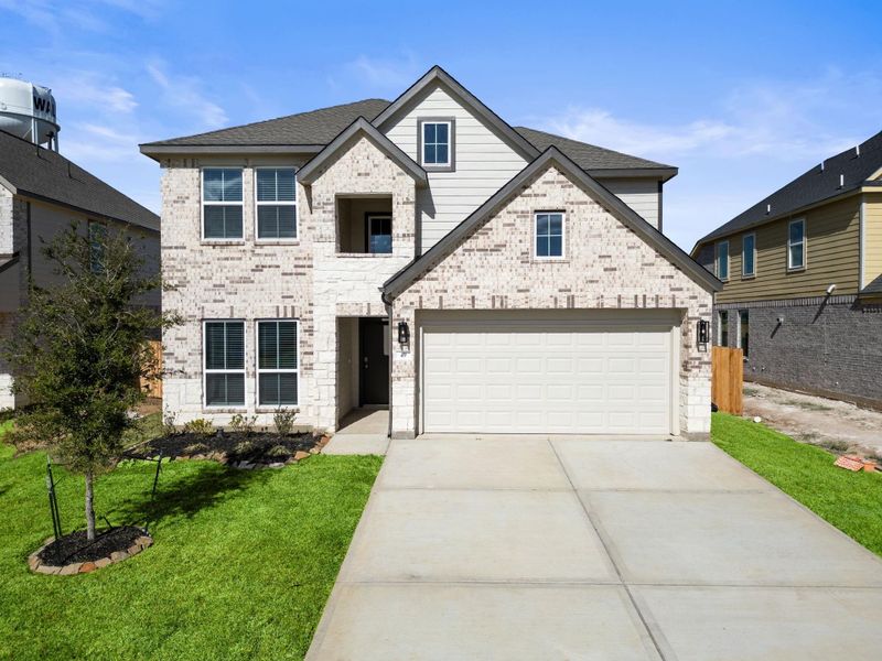 Front exterior of a new home in Beacon Hill, Waller, TX, highlighting curb appeal (Image 16). Front exterior of a new home in Beacon Hill, Waller, TX, highlighting curb appeal (Image 16).