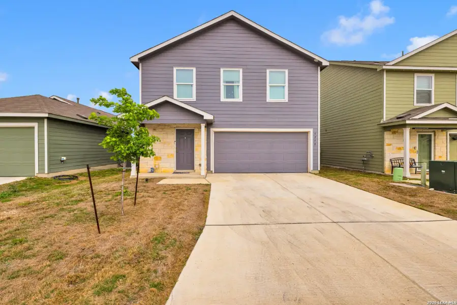 Front exterior of a new home in Morgan Heights, San Antonio, TX, highlighting curb appeal (Image 1). Front exterior of a new home in Morgan Heights, San Antonio, TX, highlighting curb appeal (Image 1).